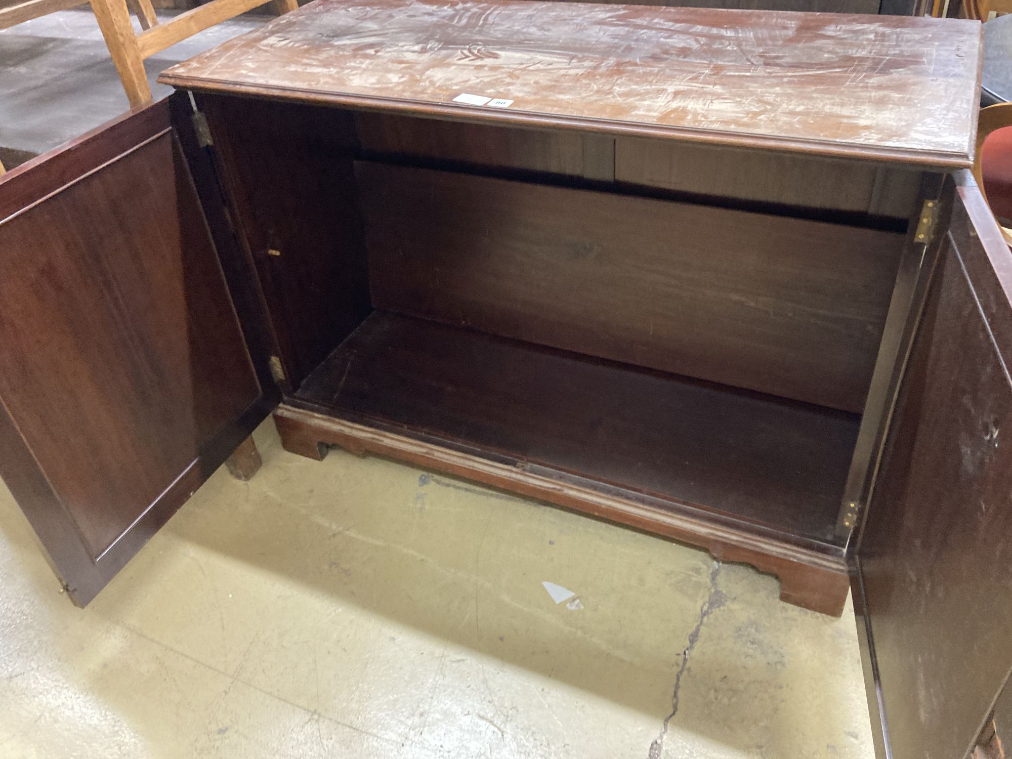 An Edwardian mahogany two door cabinet, length 122cm, depth 51cm, height 86cm